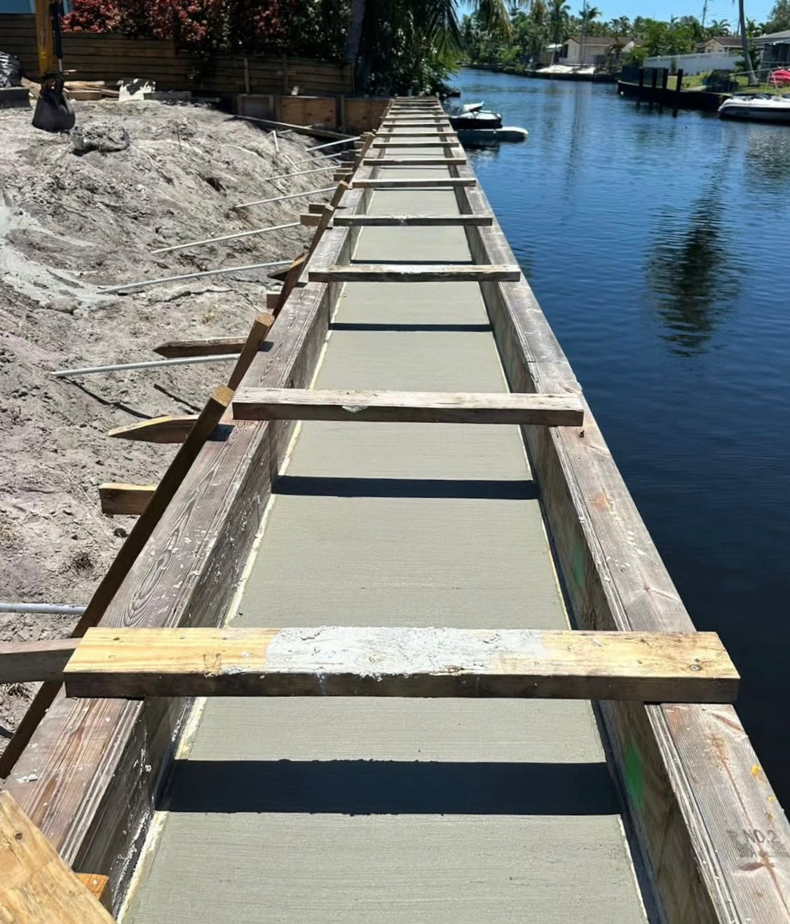 Seawall construction formwork along a canal
