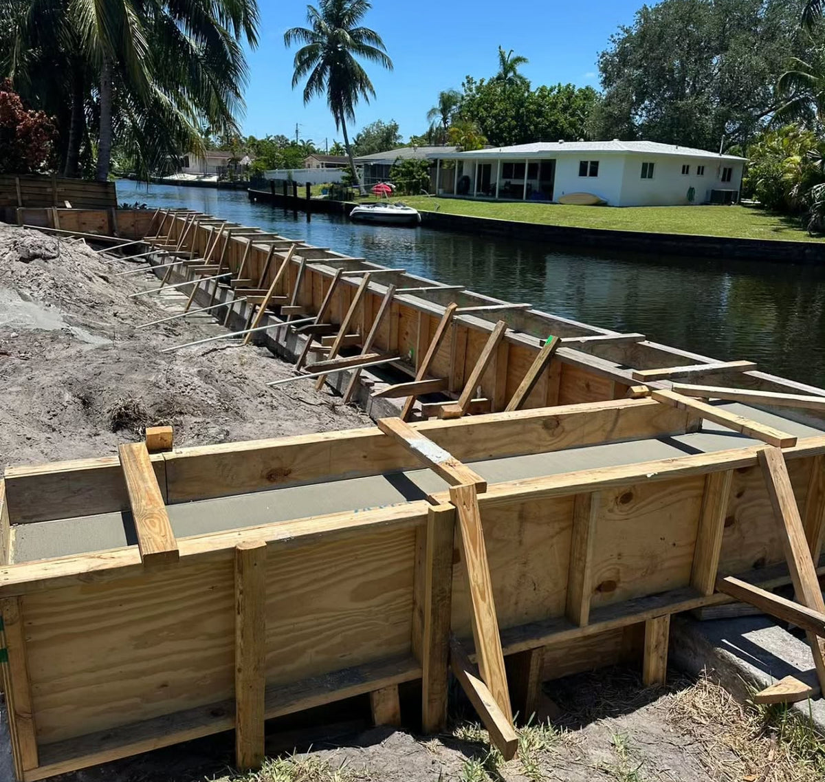 Seawall construction beside a waterfront property